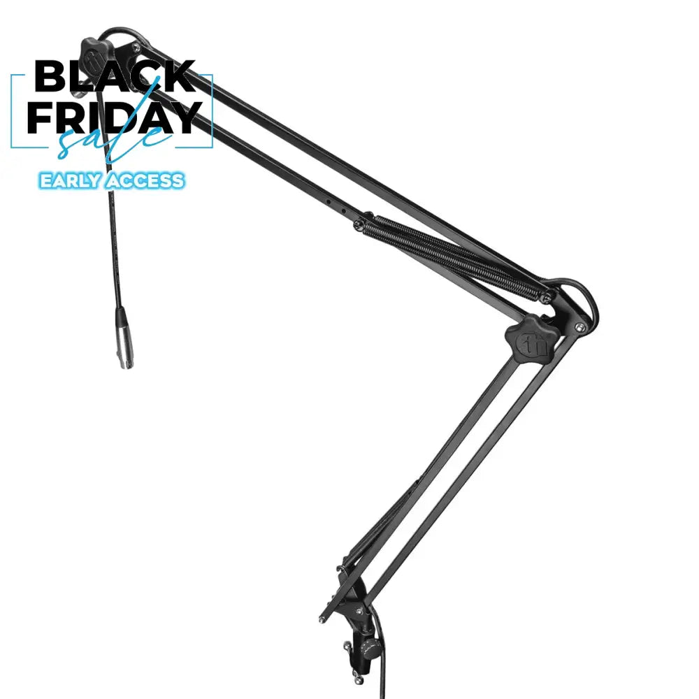 A black Adam Hall Stands S TBA 01 microphone arm with a built-in XLR cable, featuring a table clamp and spring holders.