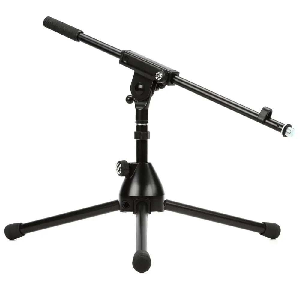 A black K&M microphone stand with a die-cast base and folding legs, complete with a boom arm.